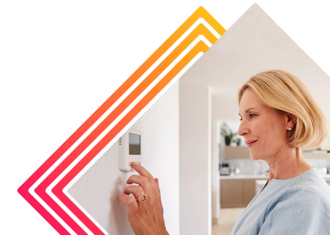 Women changing thermostat 